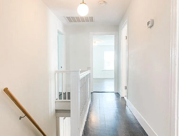 Second floor hallway to three bedrooms, bathroom, and laundry room