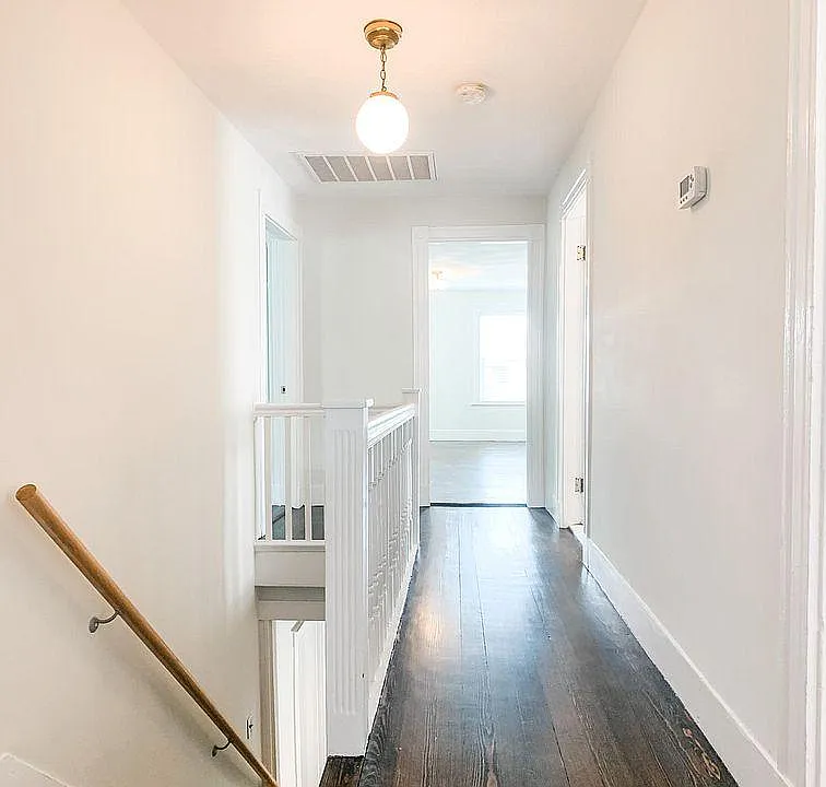 Second floor hallway to three bedrooms, bathroom, and laundry room