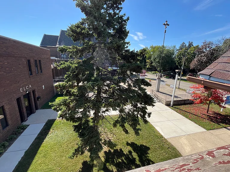 Patio overlooks church courtyard