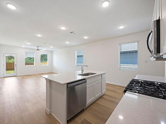 Kitchen in the Magnolia home plan by Trophy Signature Homes - REPRESENTATIVE PHOTO