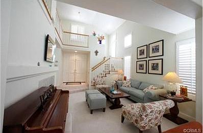 Living room looking back on double door entry