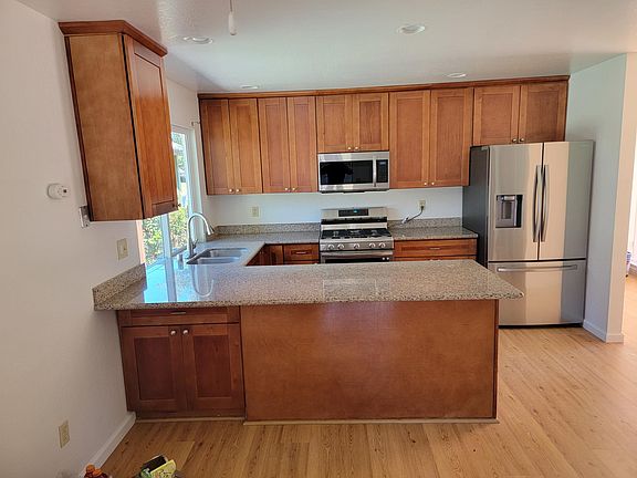 Kitchen with all stainless steel appliances.