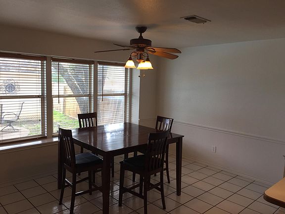 Spacious kitchen with box window.