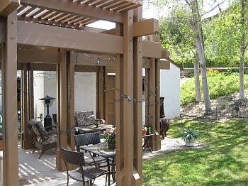 Patio adjacent to backyard