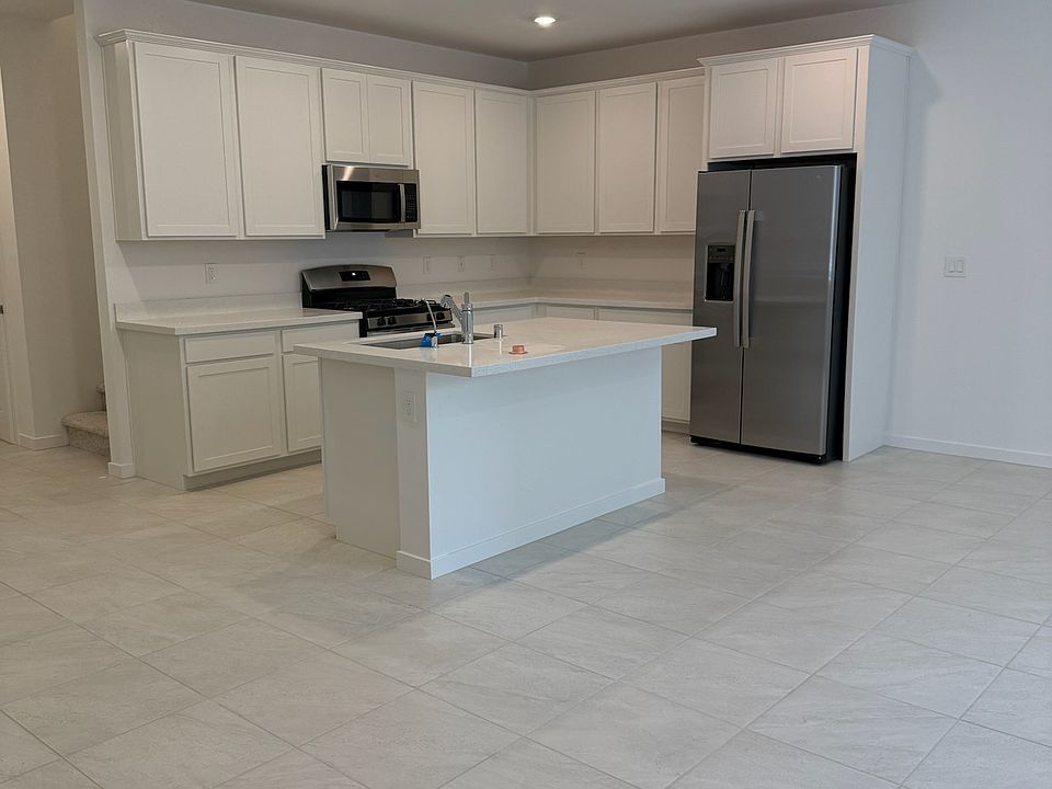 Beautiful white cabinet kitchen with sparkling counter tops