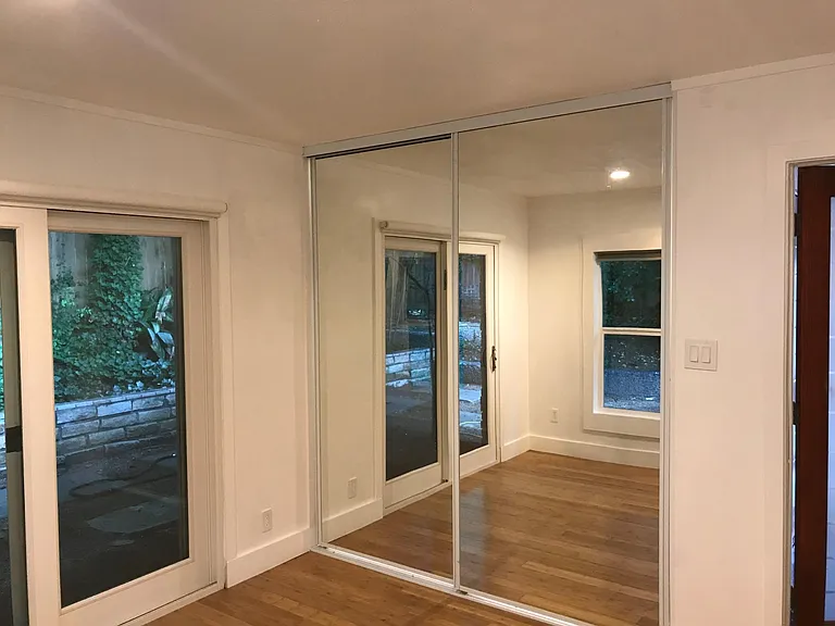 Bedroom two - mirrored closet doors bring outdoors inside. G