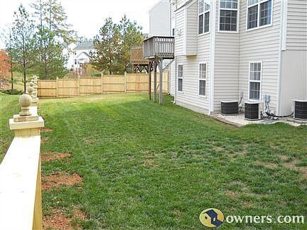 Back of home with new fence
