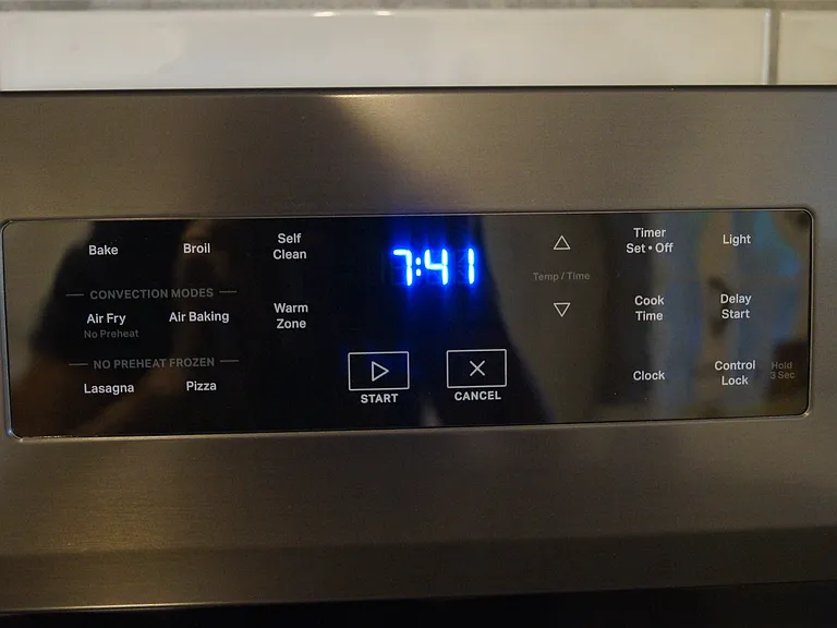 New black stainless smooth top Whirlpool electric range. Has air frying and air baking capabilities.
