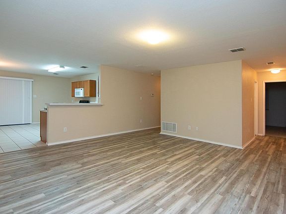 Living room looking at kitchen, dinning area, 2nd bedroom entrance