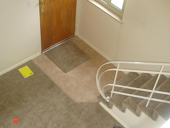 Looking down at front door from the bedroom