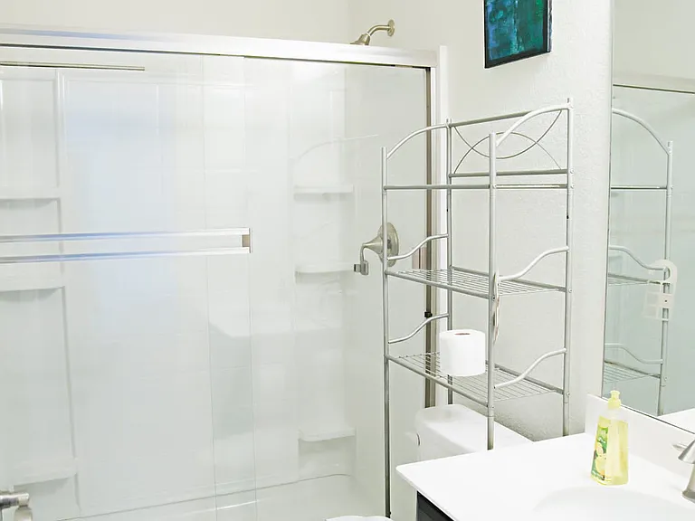 Bathroom by front entry and office.