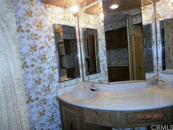 Large master bath with 2 sinks, tub/shower, and dressing area.
