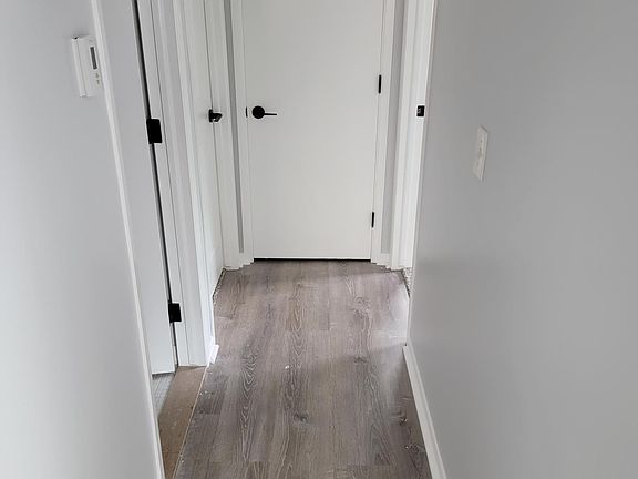 Hallway and all new floors and all new carpet throughout entire place.