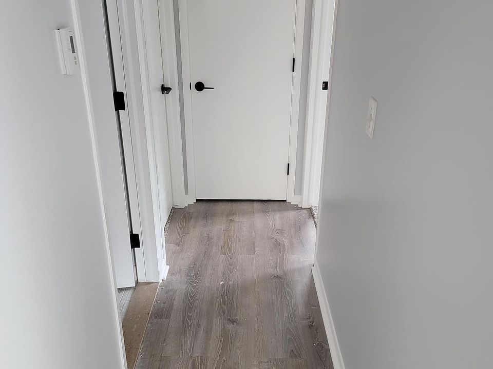 Hallway and all new floors and all new carpet throughout entire place.