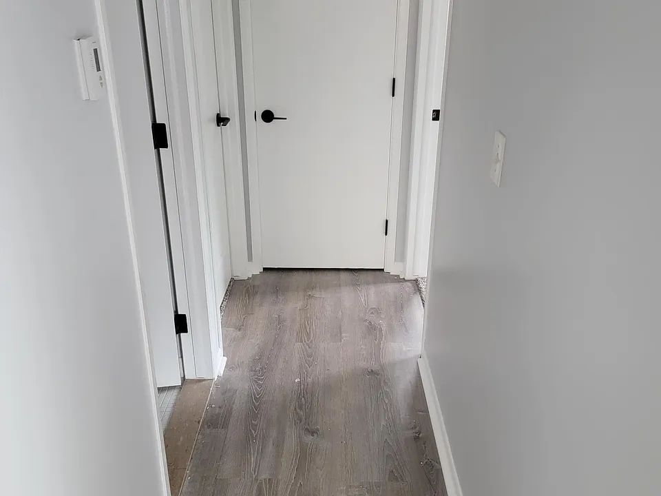 Hallway and all new floors and all new carpet throughout entire place.