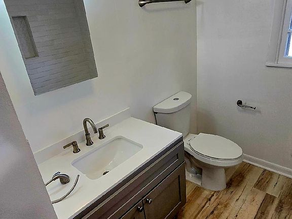 Large full bathroom with beautiful ceramic tile and thoughtful finishes and plenty of storage.