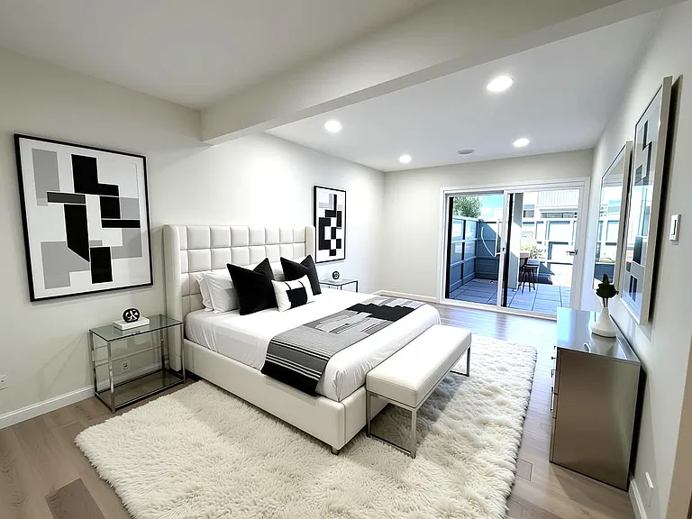 Digitally staged large primary bedroom.