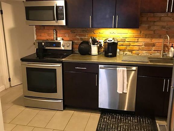 Stainless steel, the microwave is built in. 