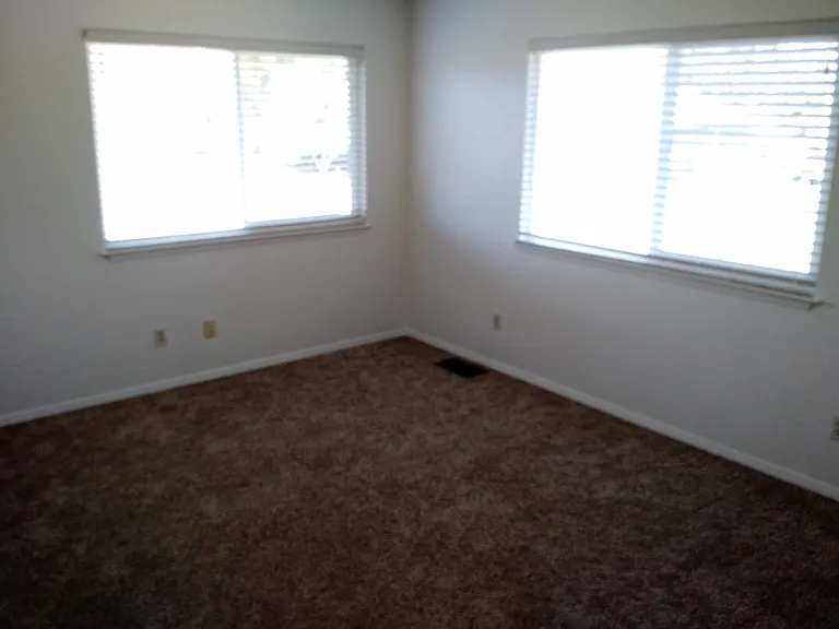 1st upstairs bedroom on corner.