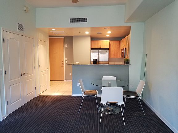 View of dining area and kitchen (from living room area as partially furnished at current time)
