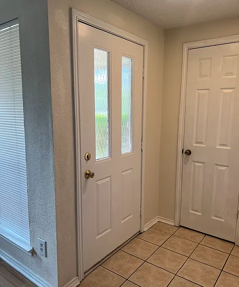 Front entry way next to Living room with 
closet