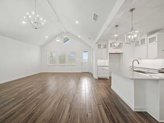 Soaring vaulted ceiling unites main living areas