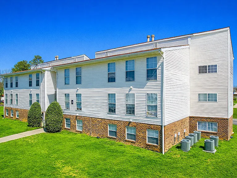 Modern apartment complex under clear sky