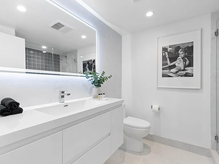 Downstairs full bathroom with a clean and minimalistic design.