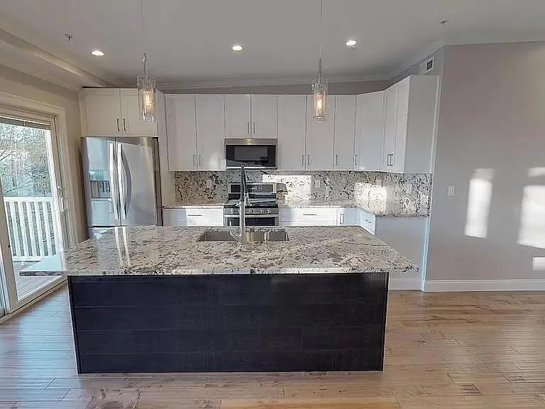 Kitchen w/plenty of natural light from balcony. 3rd floor unit provides a lot of privacy