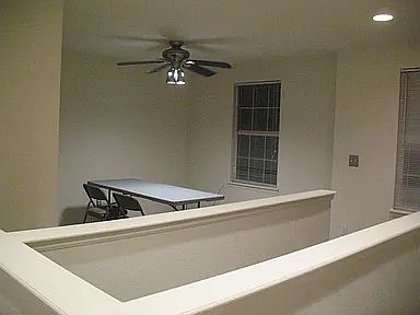 Spacious Loft with fan on left when reaching second floor