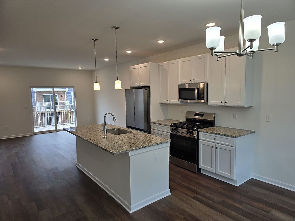 Kitchen and living room with a balcony