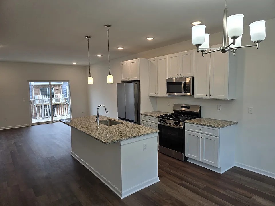 Kitchen and living room with a balcony