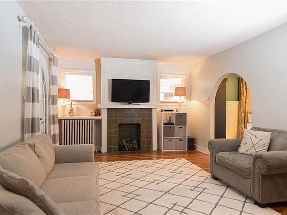 The large family room features the original hardwood floors which have been refinished.