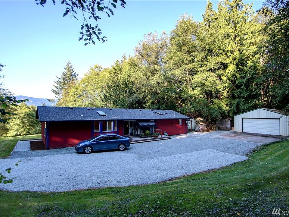 Tucked away with plenty of privacy on 4.97 wooded acres, this 3 bedroom 2 bath rambler has a NEW roof, skylights, bathroom, is clean and move in ready!  