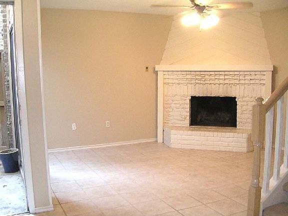 Living area complete with wood burning fireplace
