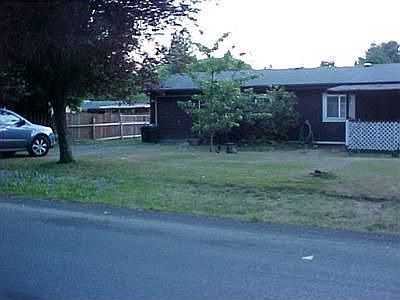 Large Gate on Left side of home so you can drive into the back yard if you wish.