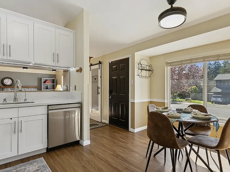 Dining area with large windows.