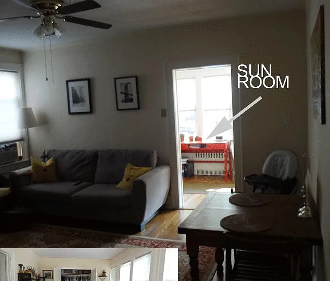 this is the opposite side of the living room (looking into the sunroom/main entrance)