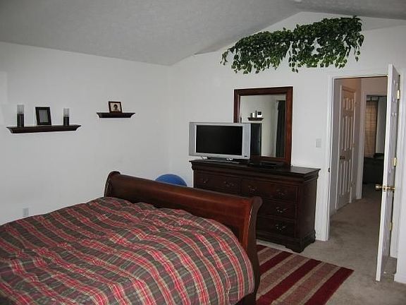 Master bedroom with plant shelf