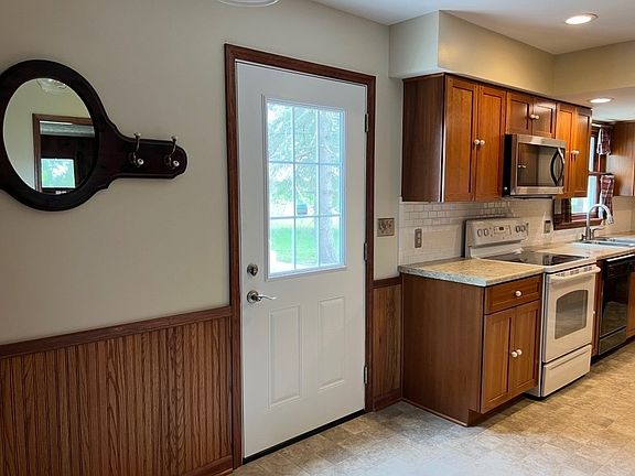 Kitchen view, room for eat-in kitchen table and small pantry to the left.