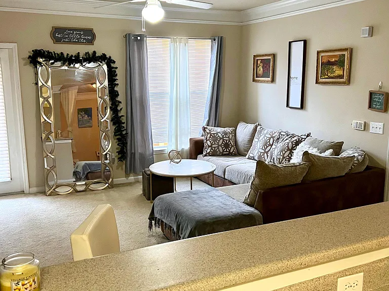Living room as furnished by a prior tenant