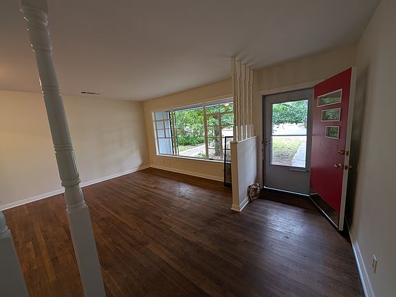Living room, with 1950s details and hardwood floors, large picture window.