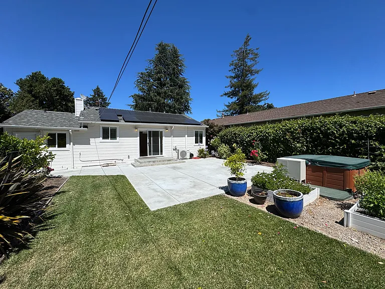 Backyard raised garden planters and spa.