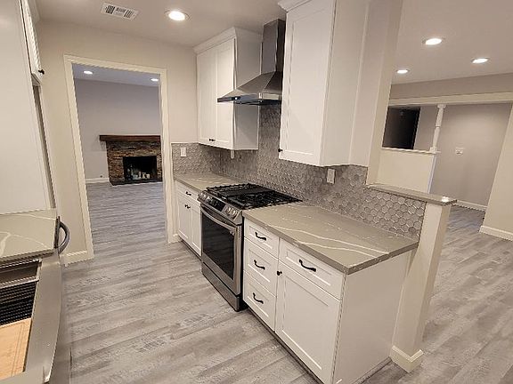 Remodeled and updated kitchen cabinets, quartz countertops and stainless appliances.