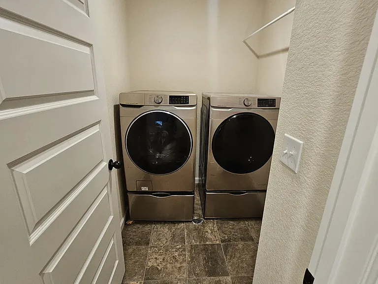 Upstairs laundry room.