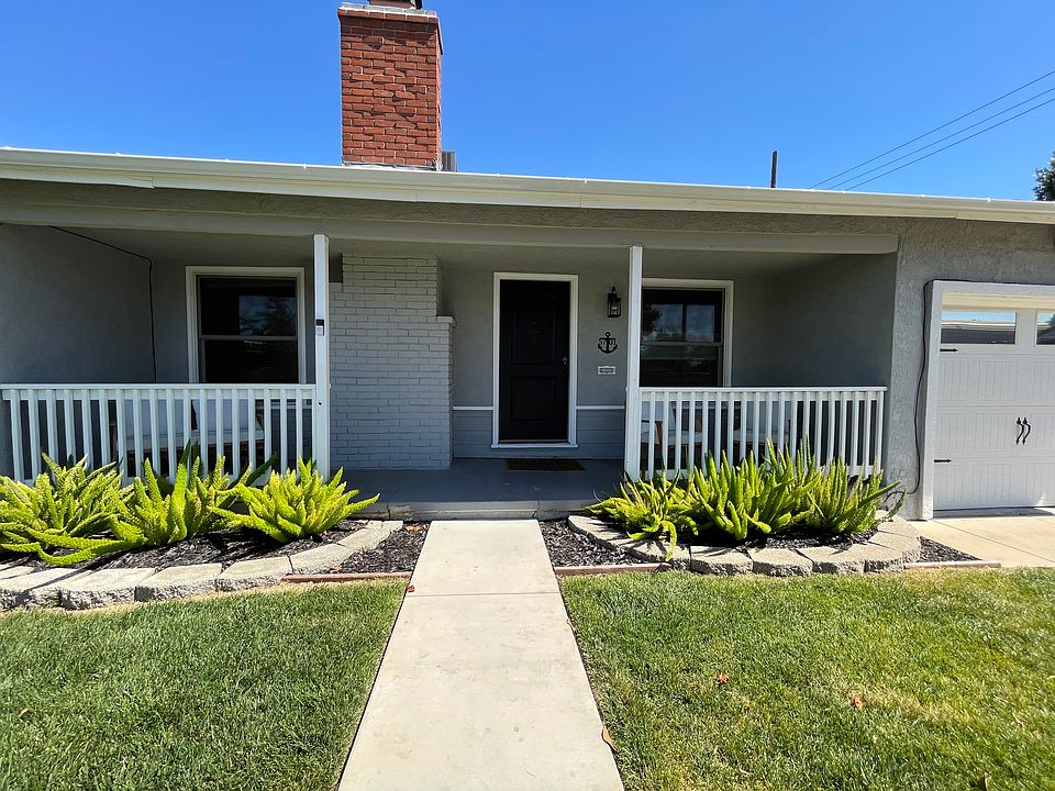 Front of the house w/ newly paved walkway.