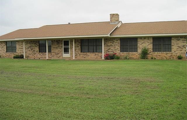 Welcome to 7882 FM 141 in Dime Box, TX. Very nice front porch to set some chairs on...catch the breezes and look at the views.