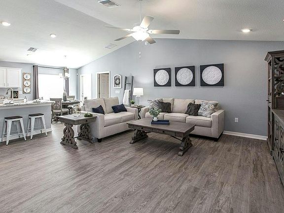 Enjoy a spacious and open living area - Begonia by Highland Homes
