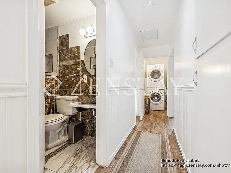 Secondary Bathroom with Standing Shower and In Unit Washer and Dryer