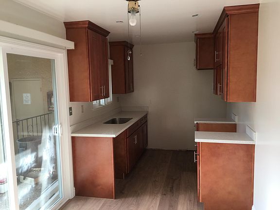 new cabinets, quartz countertops, stainless steel appliances